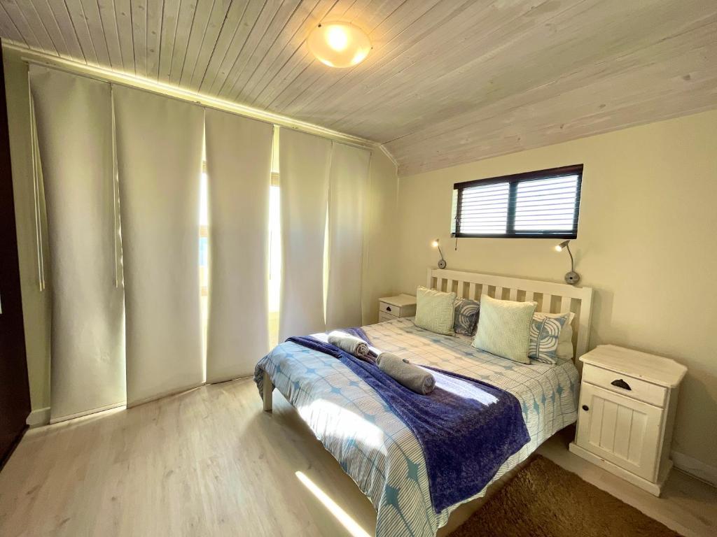 Llit o llits en una habitació de Central Beachhouse