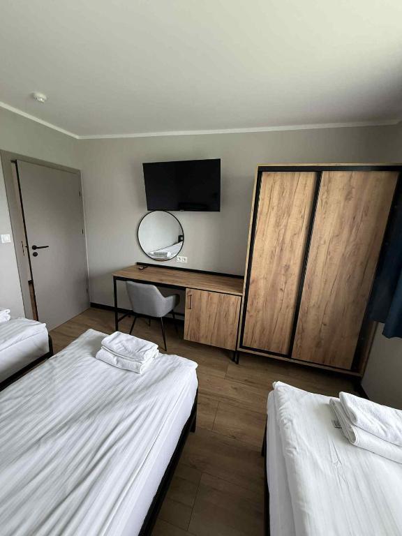 Postel nebo postele na pokoji v ubytování Hotel Kliper
