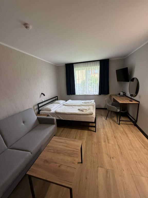 Postel nebo postele na pokoji v ubytování Hotel Kliper