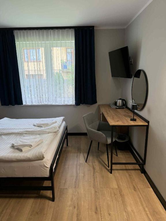 Postel nebo postele na pokoji v ubytování Hotel Kliper