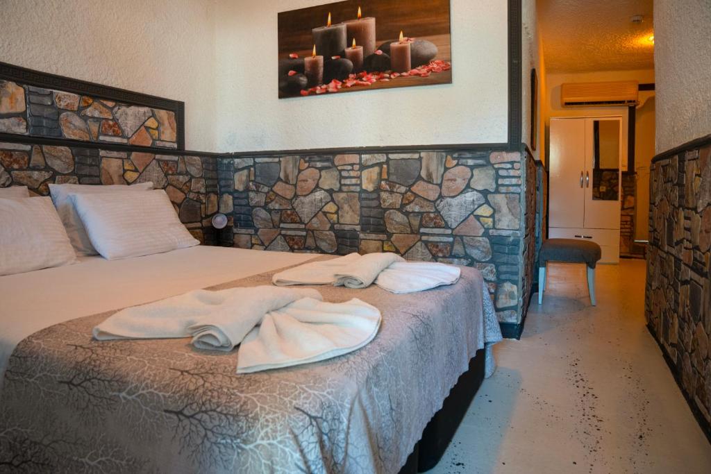 Postel nebo postele na pokoji v ubytování İMREN'S OTEL