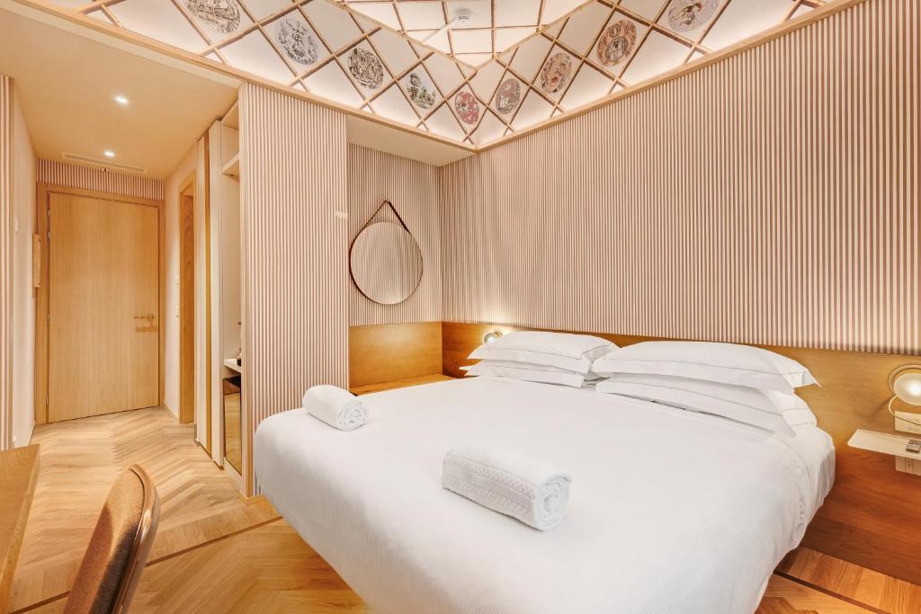Postel nebo postele na pokoji v ubytování QC room Milano Porta Romana