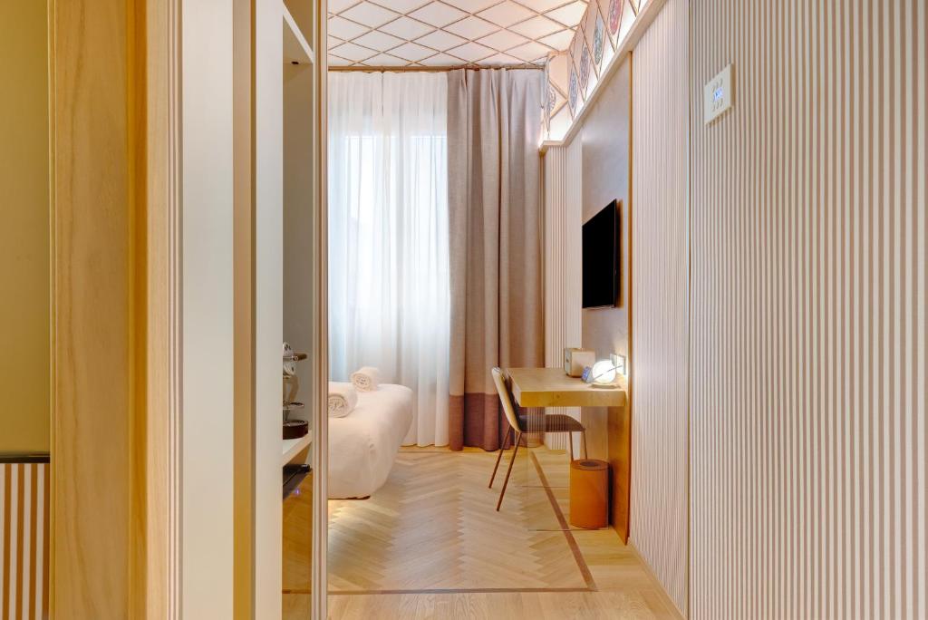TV a/nebo společenská místnost v ubytování QC room Milano Porta Romana