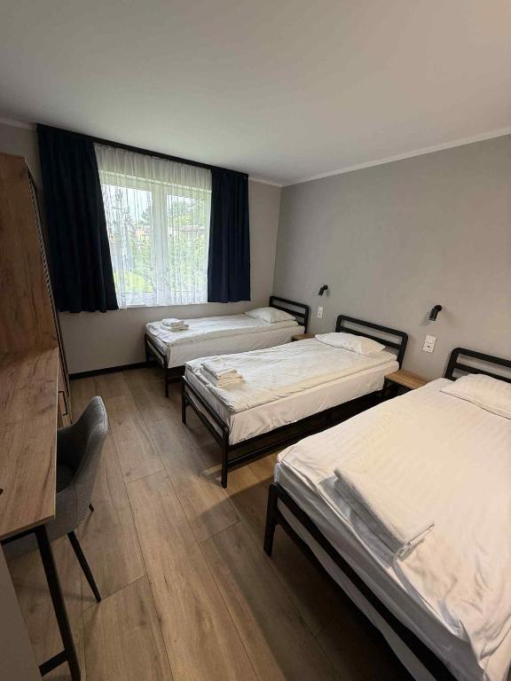 Postel nebo postele na pokoji v ubytování Hotel Kliper