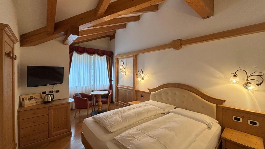Postel nebo postele na pokoji v ubytování Hotel Mirabello - Slow Hotel Benessere