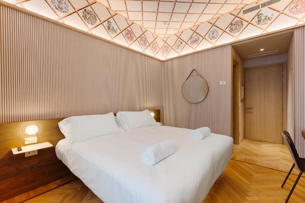 Postel nebo postele na pokoji v ubytování QC room Milano Porta Romana