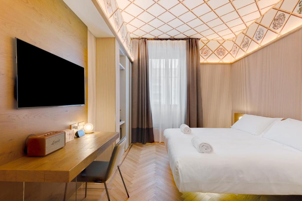Postel nebo postele na pokoji v ubytování QC room Milano Porta Romana