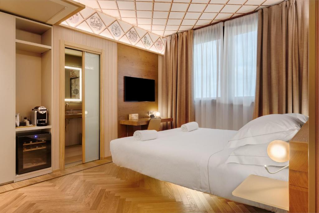 Postel nebo postele na pokoji v ubytování QC room Milano Porta Romana