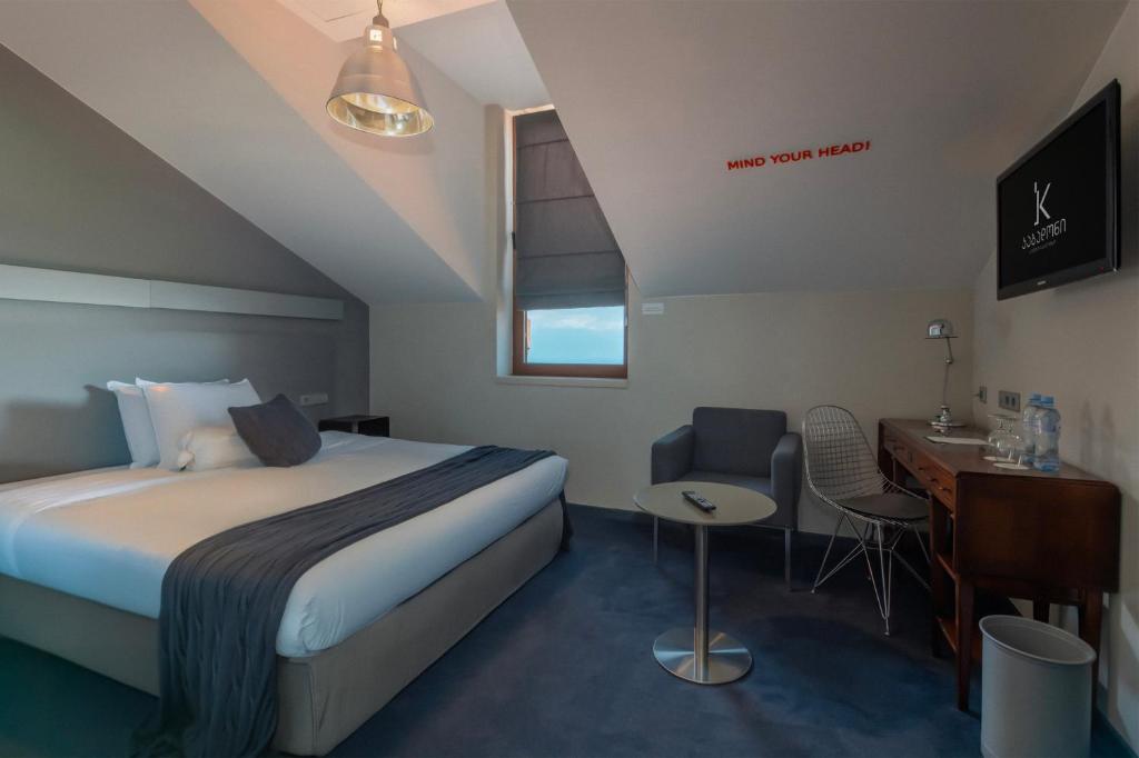 Postel nebo postele na pokoji v ubytování Kabadoni Boutique Hotel
