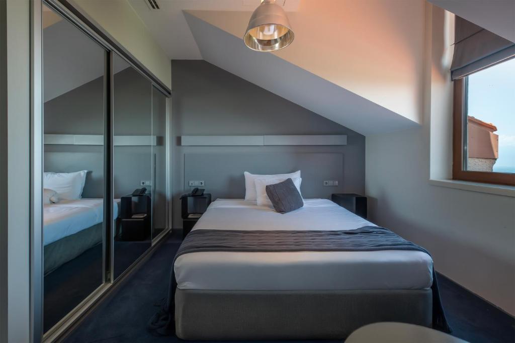 Postel nebo postele na pokoji v ubytování Kabadoni Boutique Hotel