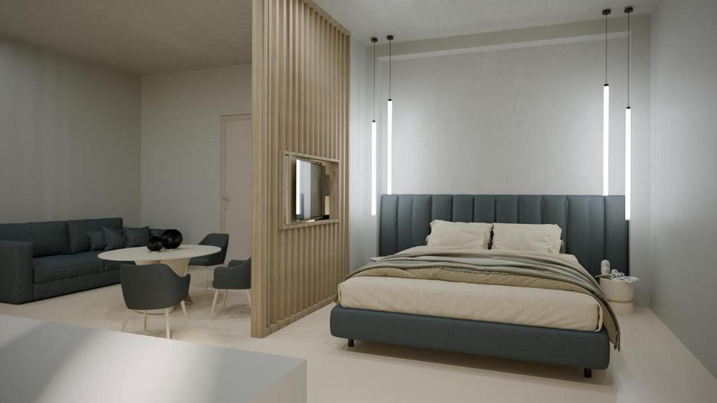 Postel nebo postele na pokoji v ubytování Gabbiano Suites