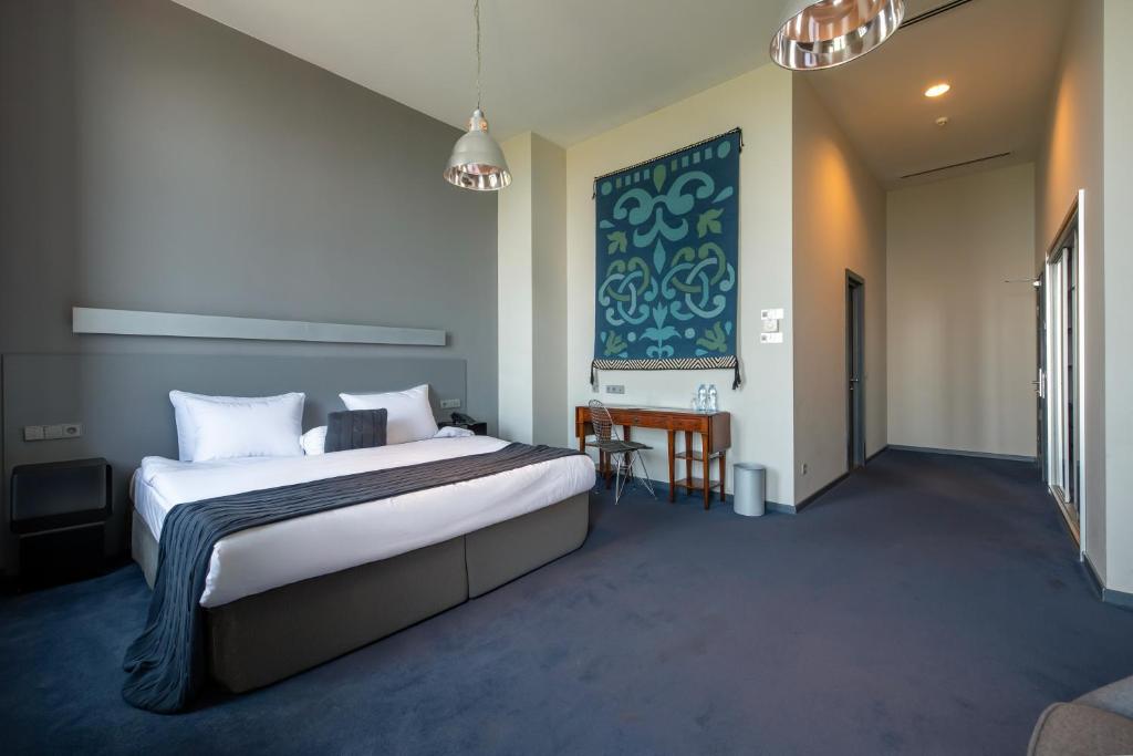 Postel nebo postele na pokoji v ubytování Kabadoni Boutique Hotel
