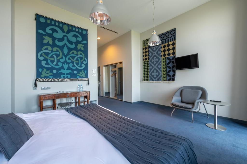 Postel nebo postele na pokoji v ubytování Kabadoni Boutique Hotel