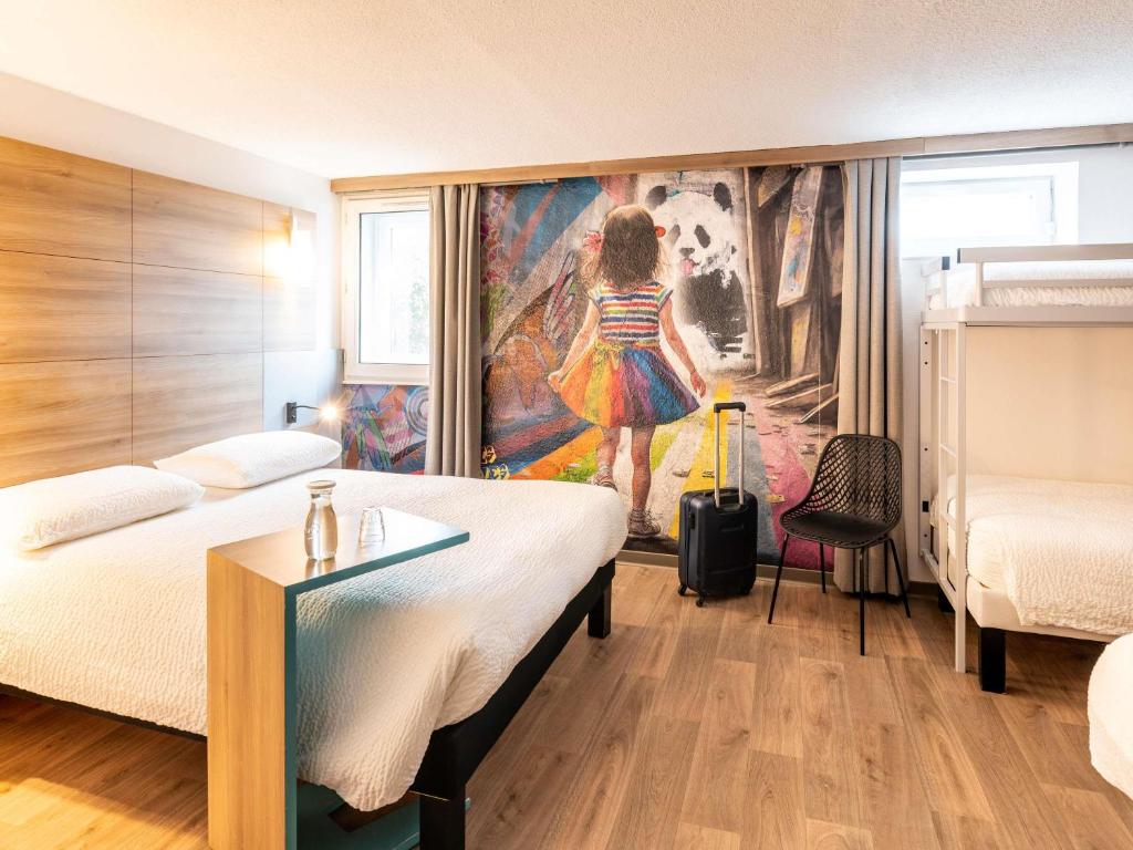 Postel nebo postele na pokoji v ubytování ibis styles Brive Ouest