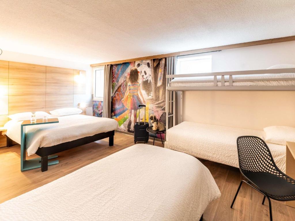 Postel nebo postele na pokoji v ubytování ibis styles Brive Ouest