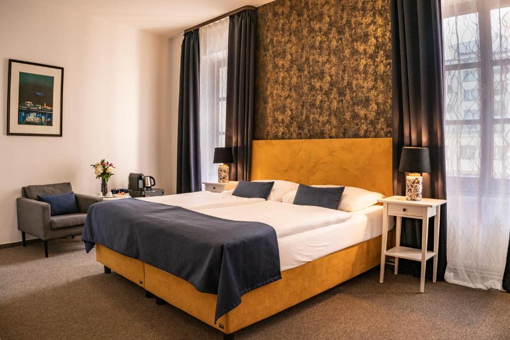 Postel nebo postele na pokoji v ubytování BlueBell Hotel