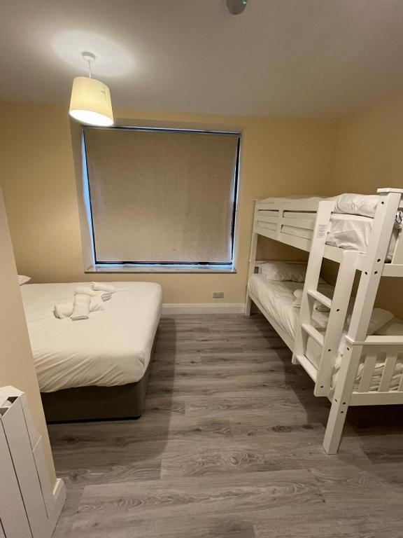 Postel nebo postele na pokoji v ubytování York Comfort Inn