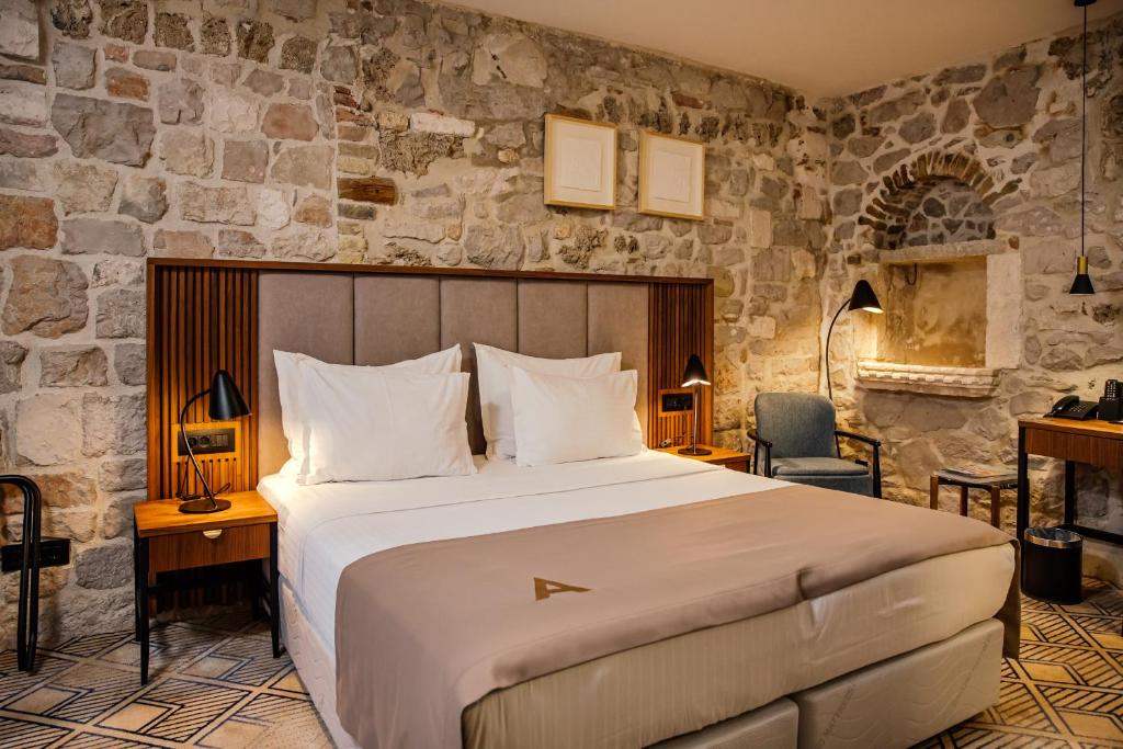 Postel nebo postele na pokoji v ubytování Armerun Heritage Hotel & Residences