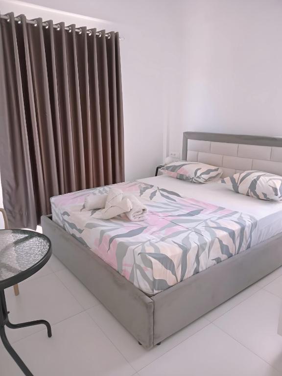 Postel nebo postele na pokoji v ubytování Ida Apartments