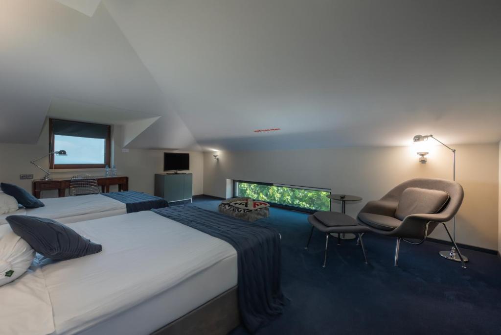 Postel nebo postele na pokoji v ubytování Kabadoni Boutique Hotel