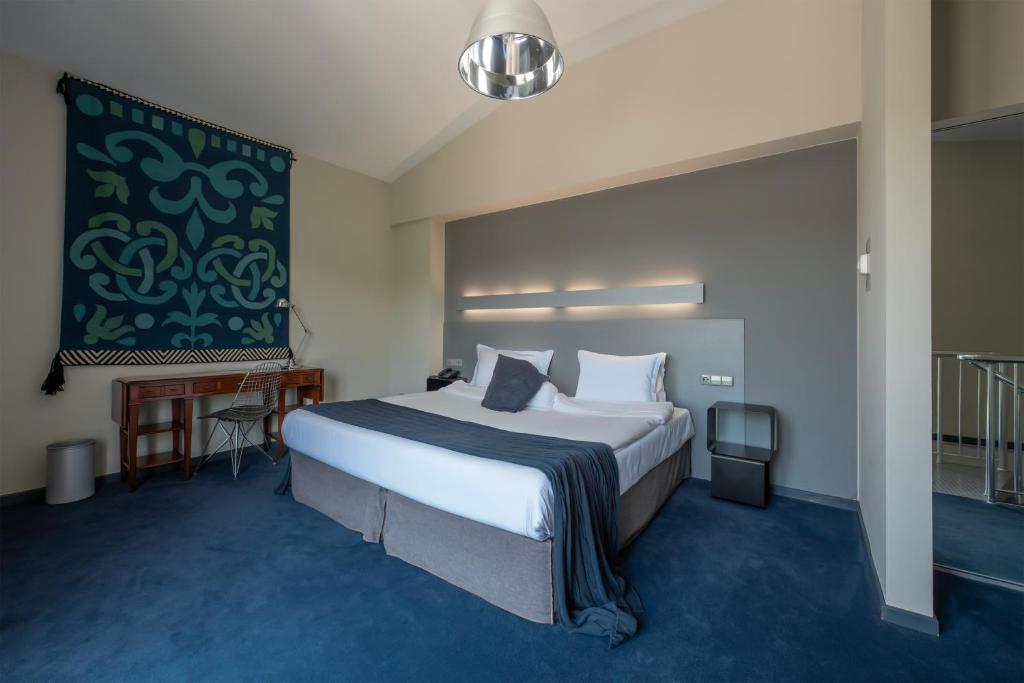Postel nebo postele na pokoji v ubytování Kabadoni Boutique Hotel
