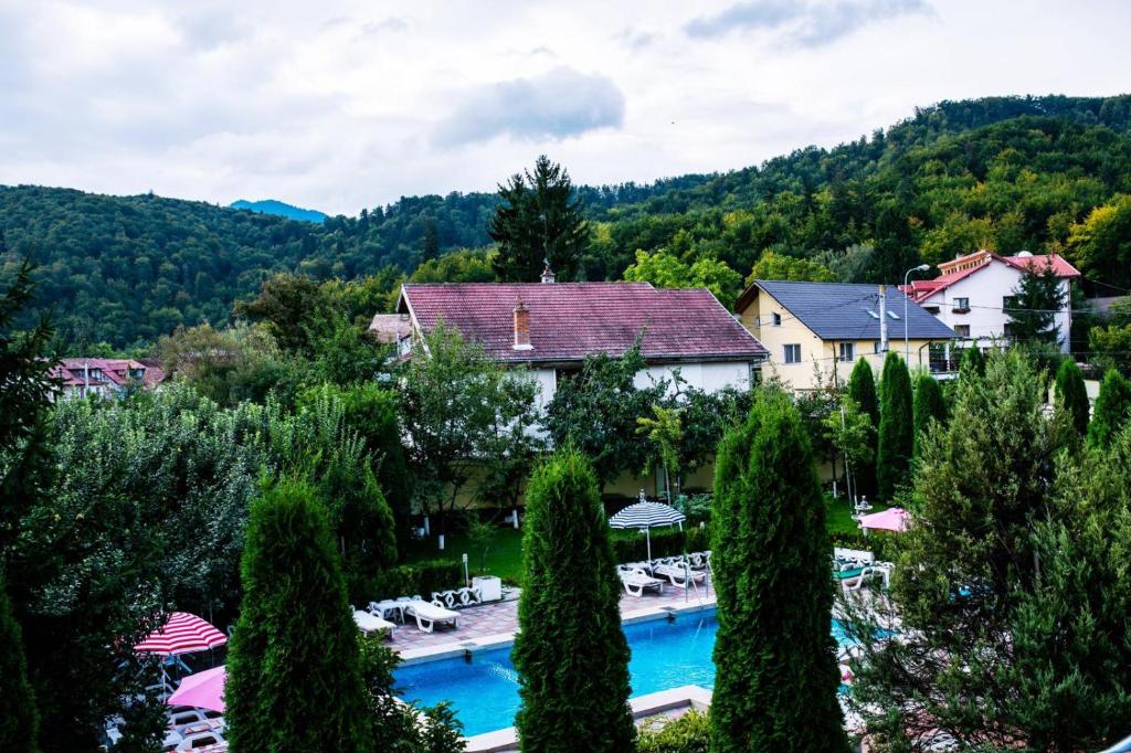 an aerial view of a resort with a swimming pool at Grand Hotel in Braşov