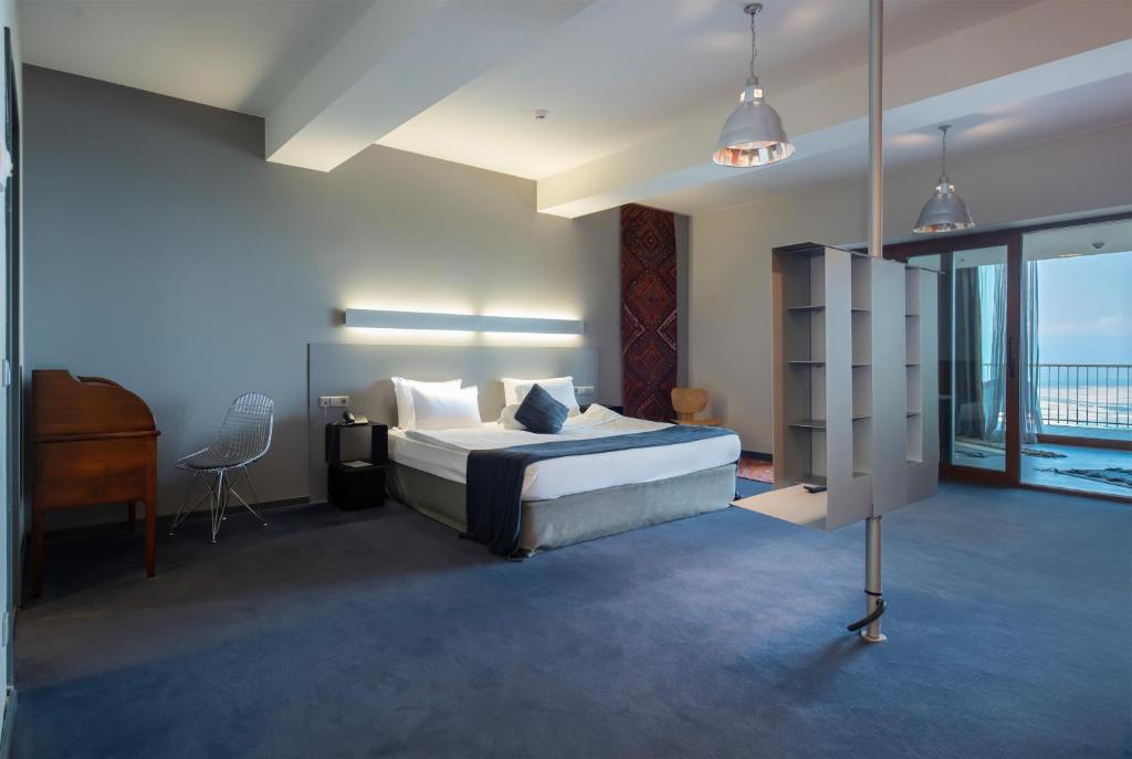 Postel nebo postele na pokoji v ubytování Kabadoni Boutique Hotel