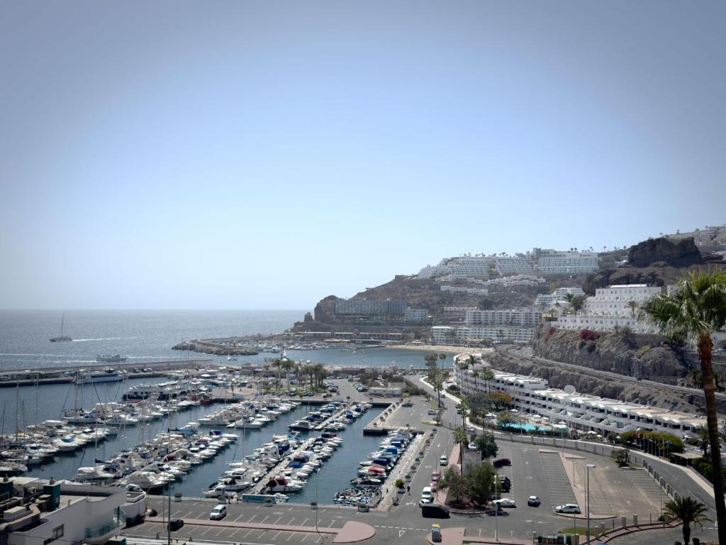 a harbor with a bunch of boats in the water at Holiday Club Puerto Calma in Puerto Rico de Gran Canaria