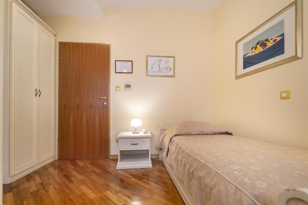 Postel nebo postele na pokoji v ubytování Hotel Peristil