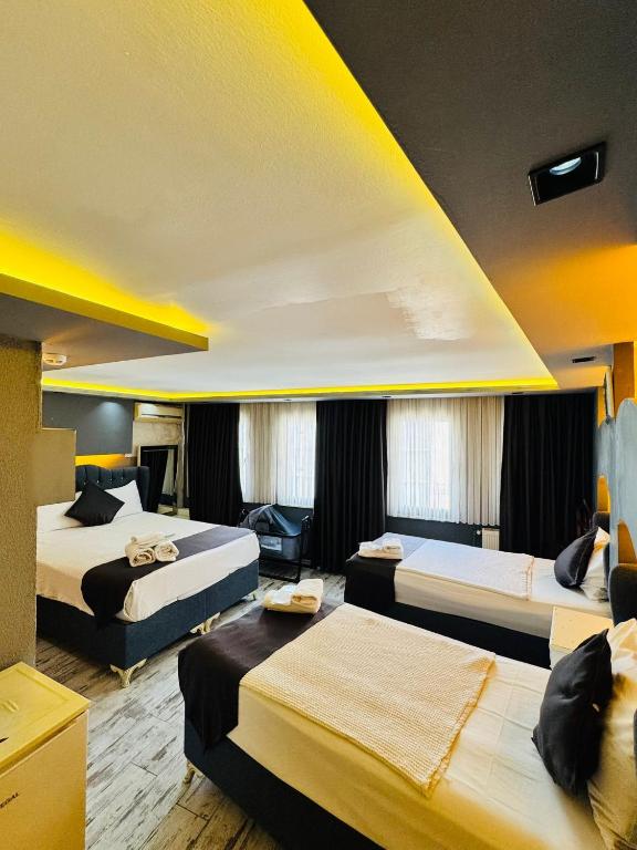 Postel nebo postele na pokoji v ubytování elisa hotel