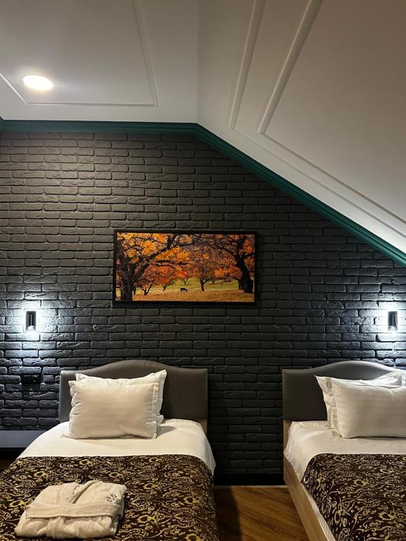 Кровать или кровати в номере Silk Road Kokand Hotel