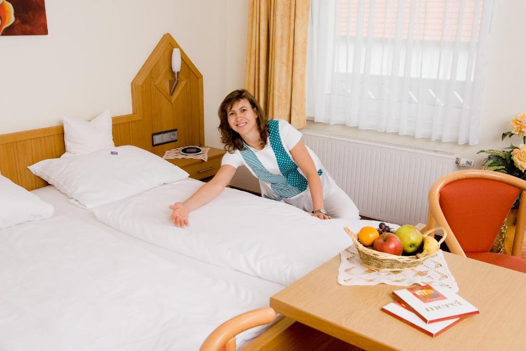 Postel nebo postele na pokoji v ubytování Hotel Haus Wiesengrund