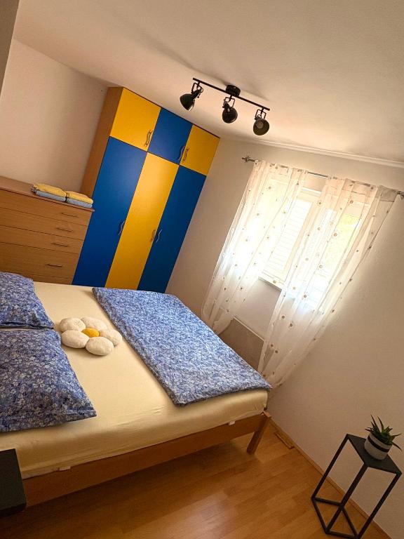 Postel nebo postele na pokoji v ubytování Apartment Teleferica Rabac