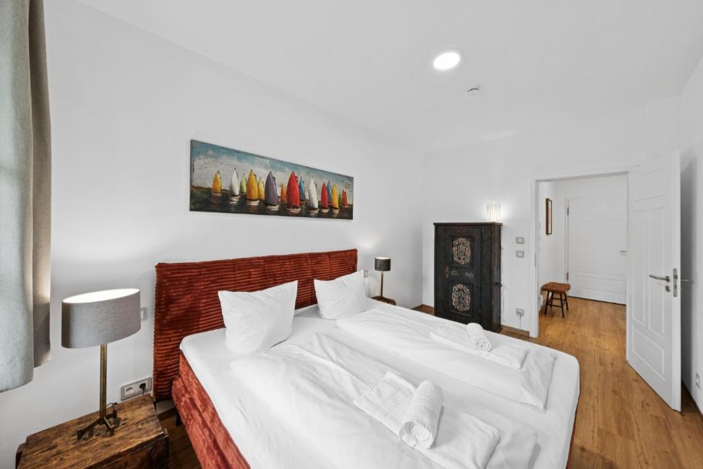 Postel nebo postele na pokoji v ubytování Vaicun Stays LUXURY APARTMENTS - Stilvolle Apartments am Tegernsee