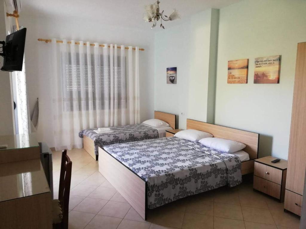 Postel nebo postele na pokoji v ubytování Ilion Hotel