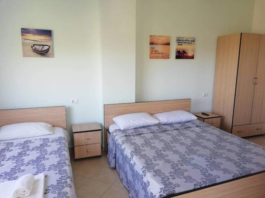 Postel nebo postele na pokoji v ubytování Ilion Hotel