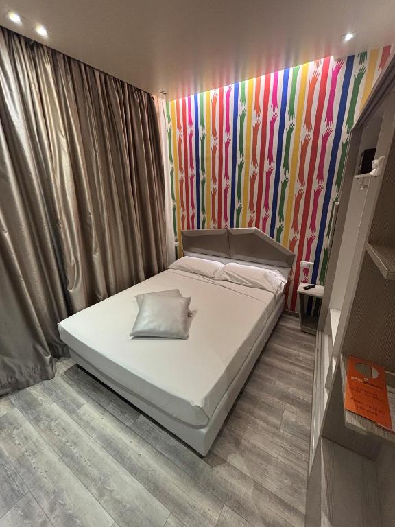 Postel nebo postele na pokoji v ubytování Hotel Fiera Wellness & Spa