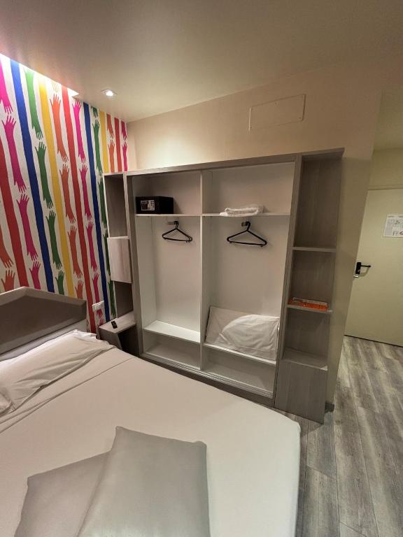 Postel nebo postele na pokoji v ubytování Hotel Fiera Wellness & Spa