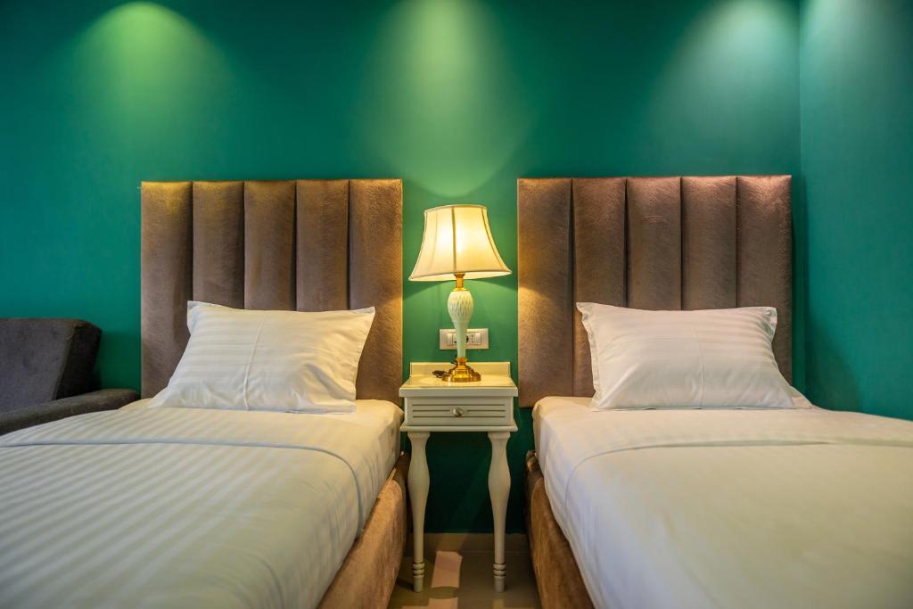 Postel nebo postele na pokoji v ubytování Hotel Craiova Olimp by Phoenicia