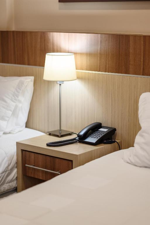 Postel nebo postele na pokoji v ubytování Bella Vista Hotel - Encarnación