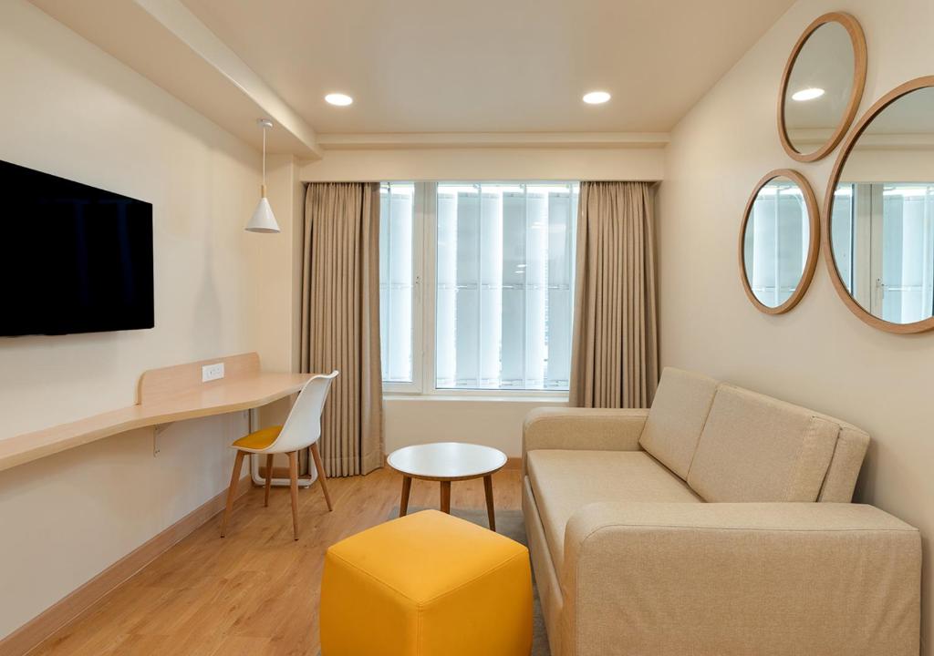 TV a/nebo společenská místnost v ubytování Bloom Hotel SG Highway