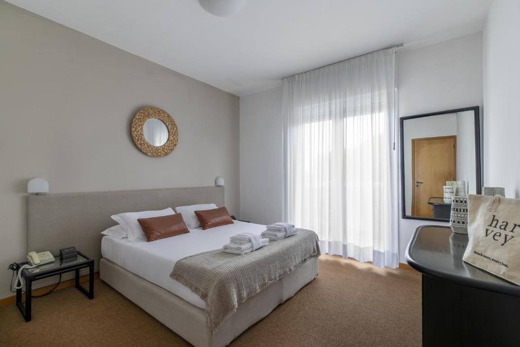 Postel nebo postele na pokoji v ubytování Harvey Suites Hotel & Residence