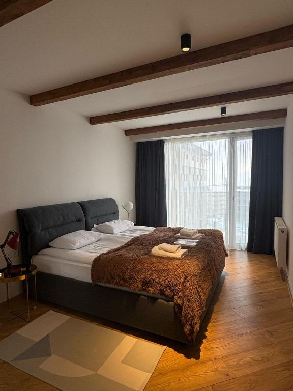 Postel nebo postele na pokoji v ubytování Go-Gudauri The Atrium Residence