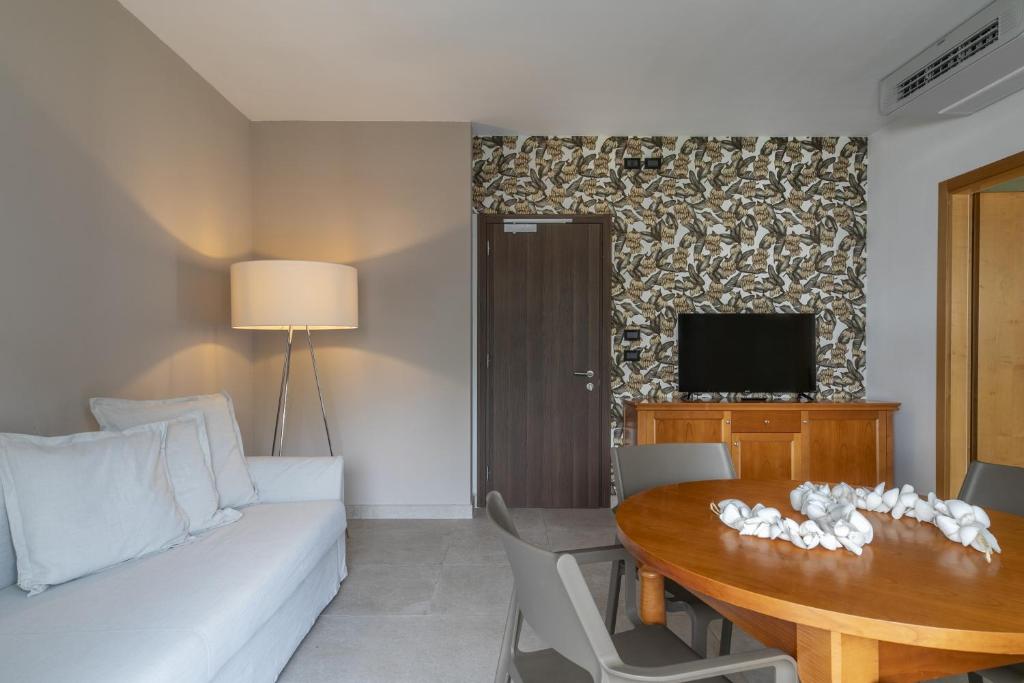 TV a/nebo společenská místnost v ubytování Harvey Suites Hotel & Residence