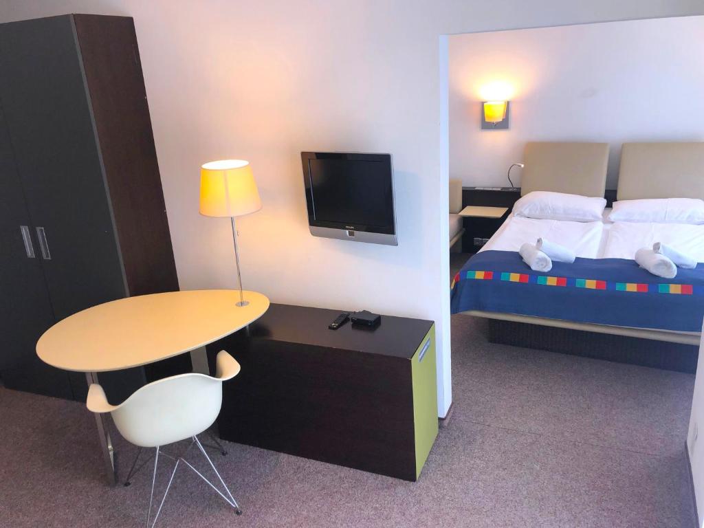 Postel nebo postele na pokoji v ubytování Hotel KOREKT