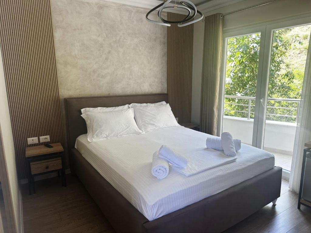 Postel nebo postele na pokoji v ubytování Hotel DEMOLI