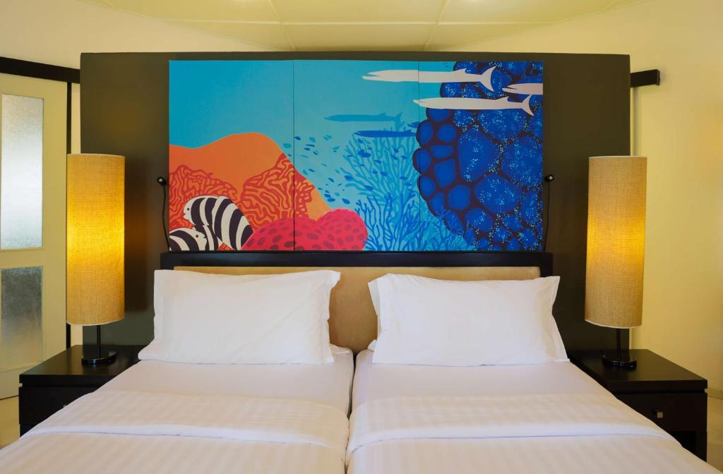 Postel nebo postele na pokoji v ubytování Angsana Velavaru - Enjoy 50 percent off seaplane and 2 times free excursions for 2 pax, Book Stay period from18 June to 30 Sep 2025