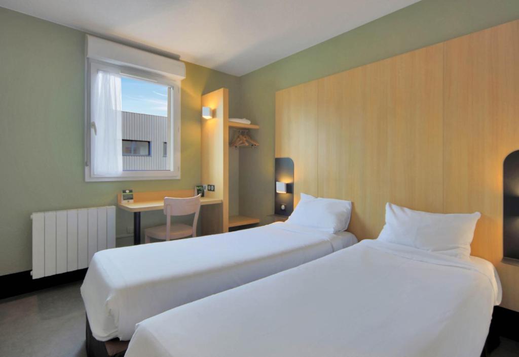Postel nebo postele na pokoji v ubytování B&B HOTEL Le Tréport Friville