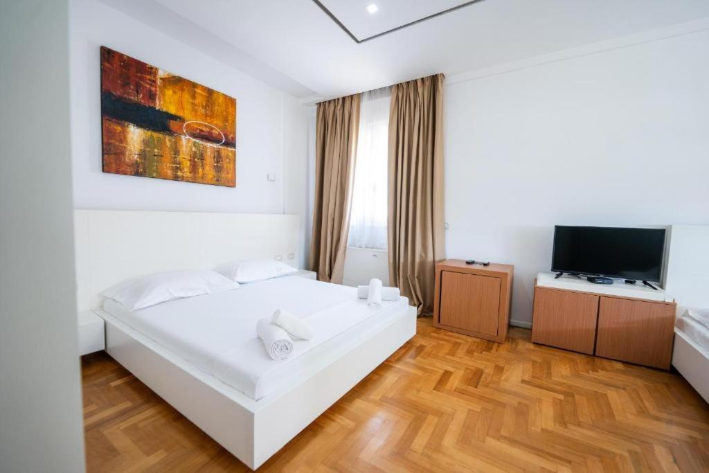 Postel nebo postele na pokoji v ubytování Thea Hotel