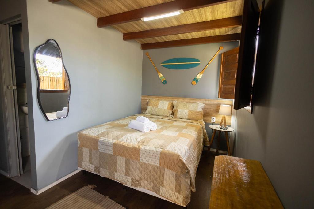 En eller flere senge i et værelse på Hospedaria Camarão da ilha